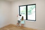 Two children enjoy the view from this double casement RAM window.