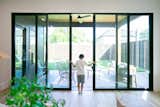 A boy opens the doors to this RAM large sliding back door in Dallas, TX.