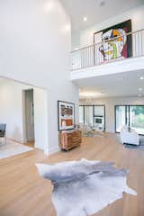 RAM sliding doors illuminate the open-concept living and entry area.