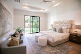 RAM sliding door illuminates this master bedroom with natural light.