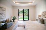 RAM sliding door illuminates this master bedroom with natural light.