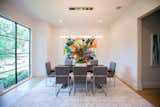 RAM picture window with grids illuminates this modern style dining area with natural light.