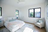 RAM casement windows brighten this guest room with natural light.