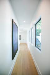 RAM picture windows brighten this upstairs hallway with natural light.