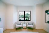 RAM double casement windows with modern grids allow for both light and air to flow into this upstairs guest room.