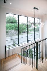 RAM expansive picture windows fill this large stairway area with natural light.