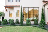 This Spanish Mission style home in Highland Park, Dallas, features RAM picture and specialty windows to welcome its guests into its airy and open space.