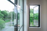 RAM picture and casement windows open this bedroom space to the outdoors.