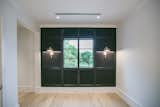 RAM picture window with grids creates a focal point on this black wall.