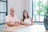 Houston area home remodeler, Drew Yoder, and his partner Skevi, sit at their kitchen table which is flooded with natural light from RAM's picture windows.