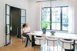Houston area home remodeler, Drew Yoder, and his partner Skevi, sit at their kitchen table which is flooded with natural light from RAM's picture windows.
