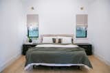 RAM casement windows sit on either side of this master bed.