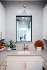 RAM's aluminum framed picture window allows for gorgeous views of the back patio area from this Houston area home's prep kitchen.