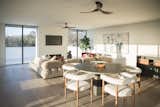 Natural light streams into this living and dining space from RAM picture windows.