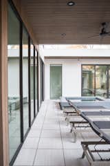 RAM all-aluminum picture windows and sliding door welcome you to this modern backyard area.