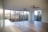 Natural light streams into this living space from RAM picture windows.