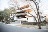 RAM all-aluminum picture windows cover the facade of this Austin-area modern home.