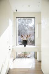 RAM picture window creates a focal point at the end of this hallway.
