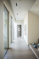 RAM picture windows create light that dances on the hallway walls of this Austin-area home.