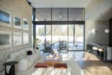 RAM picture windows create a floor to ceiling wall of light in this Austin-area home.