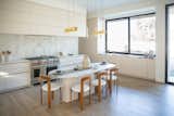 RAM sliding window allows for maximum natural light in this kitchen while allowing for easy access to the outdoors and cool breezes.