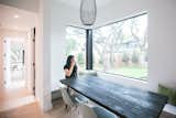 RAM sliding door and picture windows allow natural light to stream into this modern and bright breakfast area.