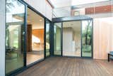 RAM sliding doors meet at this corner to provide an entire open area patio, perfect for entertaining or letting in the cool breeze on Austin nights.