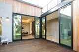RAM sliding doors meet at this corner to provide an entire open area patio, perfect for entertaining or letting in the cool breeze on Austin nights.