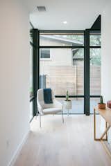 RAM large picture windows provide natural light in this warm nook.
