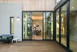 RAM sliding doors meet at this corner to provide an entire open area patio, perfect for entertaining or letting in the cool breeze on Austin nights.