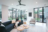 RAM sliding door and picture windows allow natural light to stream into this modern and bright living room.