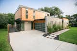 RAM picture and casement windows cover the front of this modern style home in the Barton Hills neighborhood of Austin, TX.