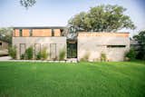 RAM picture and casement windows cover the front of this modern style home in the Barton Hills neighborhood of Austin, TX.