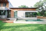 RAM picture and casement windows create a seamless transition between this master bedroom and the outdoor pool area.