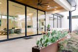 RAM floor-to-ceiling sliding door creates a seamless transition between indoors and outdoors.