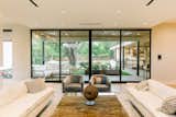 RAM's floor-to-ceiling sliding door offers beautiful views of this Dallas area backyard.