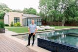 Architect, John Lively, stands in front of this Dallas area home featuring RAM windows and doors.