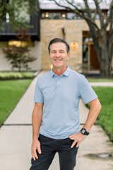 Architect, John Lively, stands in front of this Dallas area home featuring RAM windows and doors.