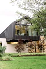 RAM picture and specialty windows help his modern cantilever take shape in beautiful Preston Hollow.