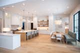 RAM picture windows with modern grids fill this modern yet warm kitchen area with natural light- perfect for entertaining or a quiet breakfast with family.