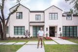 Esteemed builder, Greg Alford, stands in front of RAM picture and casement windows which cover the outside of this Dallas area home.