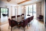 RAM picture windows with modern grids bring a sophisticated finish to this warm and bright dining room in Dallas, TX.