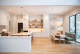RAM picture windows with modern grids fill this modern yet warm kitchen area with natural light- perfect for entertaining or a quiet breakfast with family.