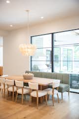 RAM picture windows with modern grids fill this modern yet warm kitchen area with natural light- perfect for entertaining or a quiet breakfast with family.