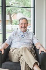 Dallas-area builder, Greg Alford, sits in front of RAM picture windows in one of his gorgeous builds in Dallas, TX.