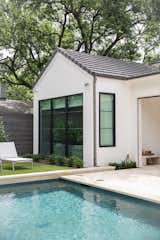 This backyard pool oasis in the heart of Dallas opens seamlessly into the home through RAM picture and casement windows with modern grids.