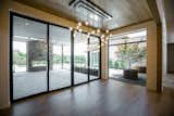 RAM 3 panel sliding door and large picture window create a grand dining area in this Westlake, TX home.