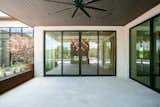 RAM sliding doors create a grand and welcoming entrance to this back porch area.