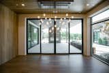 RAM 3 panel sliding door and large picture window create a grand dining area in this Westlake, TX home.
