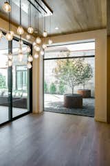 RAM 3 panel sliding door and large picture window create a grand dining area in this Westlake, TX home.